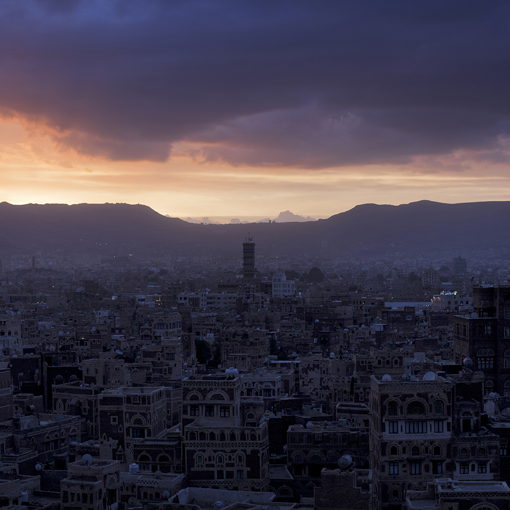 View over Sana’a Old City at dusk in Yemen.